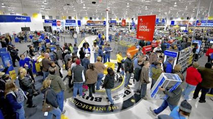Shoppers crowd a Best Buy store on Black Friday in Peoria, Ill.