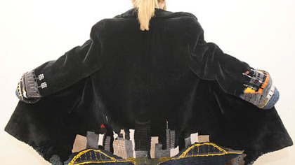 A fur coat with the Pittsburgh skyline on the back and the two stadiums on the sleeves for sale at Carl W. Herrmann Furs.