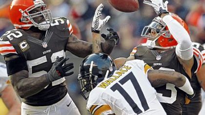 Cleveland's linebacker D'Qwell Jackson, left, and Joe Haden break up a pass intended for Mike Wallace in the fourth quarter Sunday == a pass that would ultimately be intercepted by defensive tackle Billy Winn.