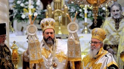 The newly ordained Bishop Gregory of Nyssa, formerly Father Gregory Tatsis, faces the congregation Tuesday after receiving the Episcopal staff and mitre during his ordination as bishop for the American Carpatho-Russian Orthodox Diocese of the USA at Christ the Saviour Cathedral in Johnstown, Cambria County. To the right is Archbishop Demetrios of America, who presided over the ceremony.