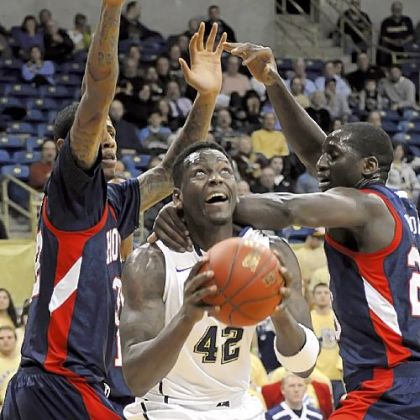 Howard's Theodore Boyomo, right, grabs Talib Zanna. Zanna contributed 12 points and eight rebounds.