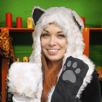 Ivana Kelly, at Ivana's Igloo, wears one of her animal hoods with paw mittens at the bottom of the  attached scarf.
