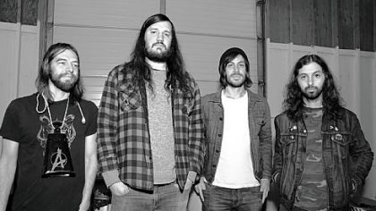 Jake Leger, left, David Wheeler, Jim Wilson and Chris "Twiz" Tritschler make the rounds in their band Carousel.