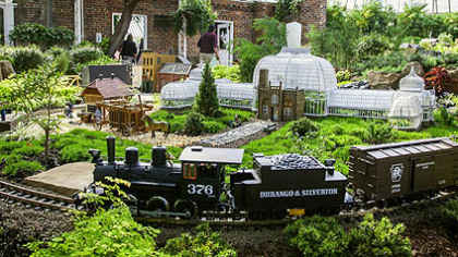 Phipps Conservatory and Botanical Garden in Oakland opened in 1893, in time to receive many of its original plantings from the 1893 World's Columbian Exposition in Chicago after it closed. The Garden Railroad display in the Winter Flower Show at Phipps depicts plants arriving by train, as they did in the late 19th century, and making their final trip into the glass house in a horse-drawn cart.