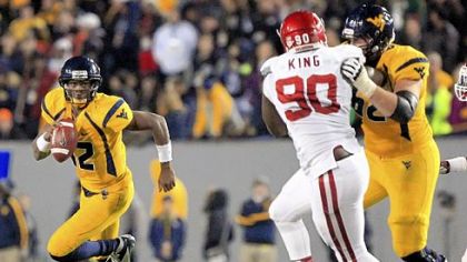 Quarterback Geno Smith holds the West Virginia career passing yardage record (11,054) and career pass attempts record (1,413).