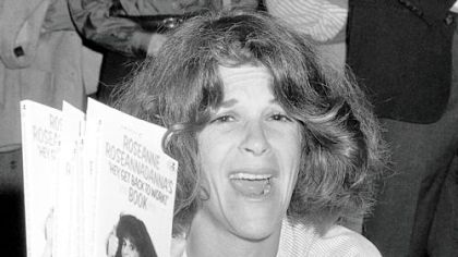 In this September 1982 photo, actress Gilda Radner holds up copies of her books at a New York bookstore.