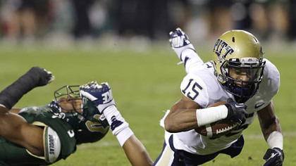Pittsburgh wide receiver Devin Street dives for an extra yard after getting tripped up by South Florida safety JaQuez Jenkins during the first half.
