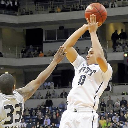 Pitt's James Robinson puts up a shot against Oakland''s Ryan Bass in the second half at the Petersen Events Center Saturday night.