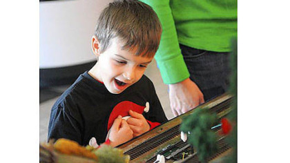 Ethan Rakip, 6, of South Park reacts to seeing a mail bag picked up by a train at the Carnegie Science Center on the North Shore on Saturday.