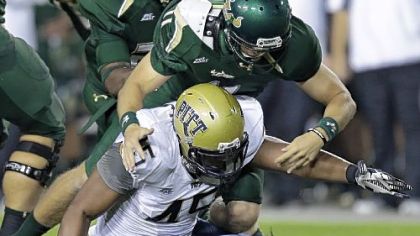Pittsburgh defensive lineman Shayne Hale (45) and South Florida quarterback Matt Floyd (11) reach for a fumble by Floyd in the first quarter.