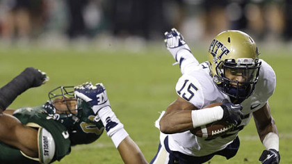 Pittsburgh wide receiver Devin Street dives for an extra yard after getting tripped up by South Florida safety JaQuez Jenkins during the first half.