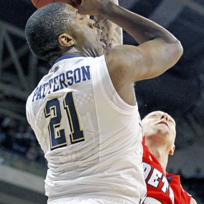 Lamar Patterson has a shot blocked by Detroit's Nick Minnerath in the first half Saturday night.