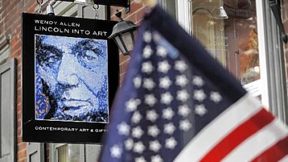 An art gallery on Baltimore Street in Gettysburg displays a flag from 1863.