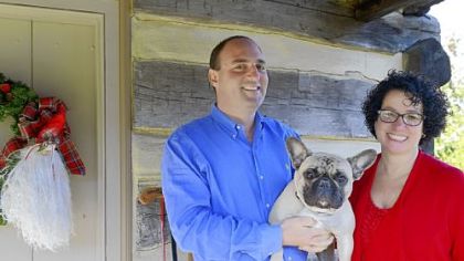 John and Mohylyn Yocca, with their French bulldog, Bruno. The Yoccas bought a 15-foot tree, instead of their usual 12-foot tree, when they spruced up their home for the watchful Shepard House Tour.