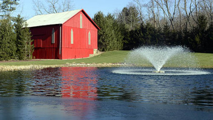 The barn and pond on the property.
