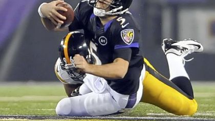 Steelers' Ziggy Hood takes down Ravens quarterback Joe Flacco in the third quarter Sunday in Baltimore.