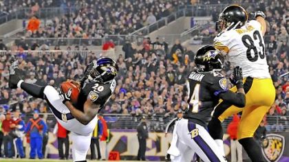 Ravens safety Ed Reed intercepts a pass intended for Heath Miller in the end zone in the fourth quarter Sunday in Baltimore.