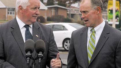 Gov. Tom Corbett and Rep. Mike Turzai talk after a ceremony to mark the completion of construction work on Route 19 in McCandless on Monday.