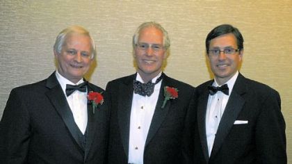 YMCA CEO Rigg Riggins, honoree Clifford Rowe Jr., and Robert Cottington.