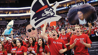 Duquesne students cheer on their team as it takes on Pitt during the City Game at Consol Energy Center.