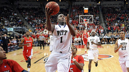 Pitt point guard Tray Woodall drives to the net against Duquesne in the second half of the City Game at Consol Energy Center.