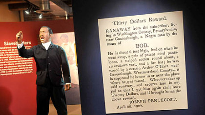 A blow up of a Gazette clipping, right, is seen before a statue of abolitionist Martin R. Delany.