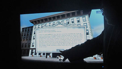 Samuel Black, director of African American programs at the history center, demonstrates an interactive computer program highlighting Pittsburgh's role in the Underground Railroad.