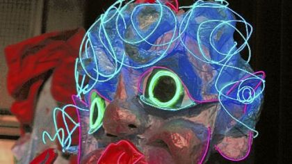 Neon is used to accent a giant puppet that will be part of First Night festivities New Year's Eve.