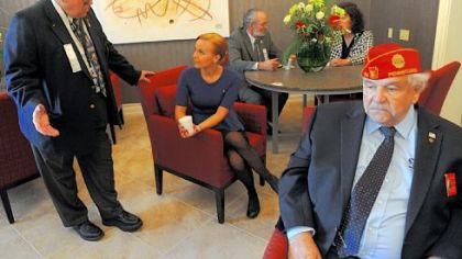 James Bruder, left, of Carrick talks with Crystal Fisher, center, in the newly opened 10-room Fisher House at the Veterans Affairs Pittsburgh Healthcare System grounds in Oakland on Tuesday. At right is Dominic DiFrancesco of Middletown, Dauphin County. Ms. Fisher is the daughter of Fisher House Foundation Chairman and CEO Ken Fisher.