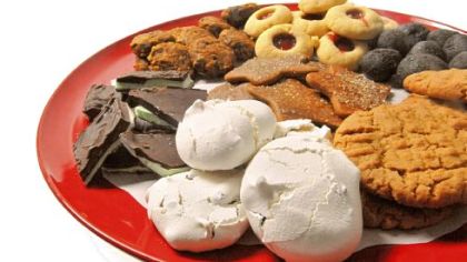 Pictured clockwise from left: Peppermint Chocolate Slices, Pumpkin Oaties, Jam Drops, Almost Raw Chocolate Cashew Fudge, Sunflower Seed Butter Cookies, Chocolate Chip Meringues. Center: Gingerbread Cookie Cutouts.