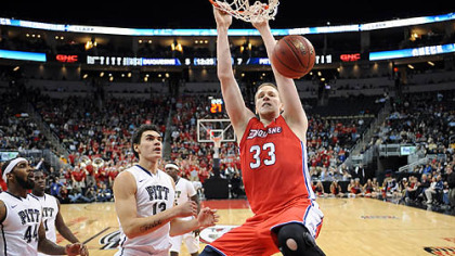 Duquesne's Martins Abele dunks in front of Pitt's Steven Adams in the first half of the City Game Wednesday at Consol Energy Center.