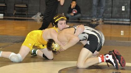 North Allegheny's Dom Forys, left, defeating Belle Vernon Area's Nate Russo during a match last season, finished third in the WPIAL and state tournaments at 106 pounds.