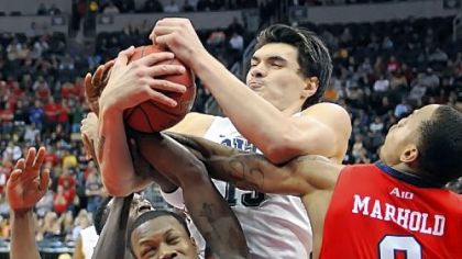 Pitt's Steven Adams fights for a rebound against Duquesne's Derrick Colter, left, and Andre Marhold in the second half of the annual City Game Wednesday night at Consol Energy Center.