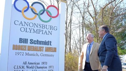 Canonsburg Mayor Dave Rhome, left, and honoree Bill Schmidt, who won a bronze medal in the 1972 Olympics in Munich, unveil a landmark in recognition of the 40th anniversary on Saturday.