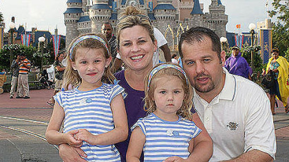 Carrie Goretzka with husband, Michael, and daughters Chloe, left, then 4, and Carlie, then 2, at Disney World in 2009.