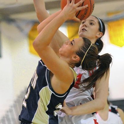 Norwin's Rachel Dellefemine, left, has her shot blocked by Shaler's Andrea Lydon, right, in season-opening action at Penn-Trafford High School.