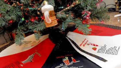 Carol Johnson made a tree skirt with drink recipes for the rec room bar.