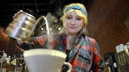 Rachel Grozanick brews a cup of Kenyan coffee at 21st Street Coffee and Tea in the Strip District.