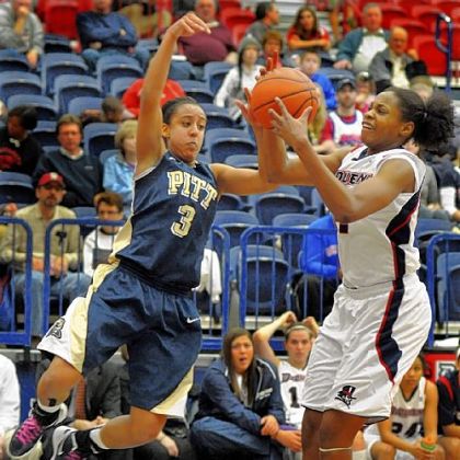 Pitt's Brianna Kiesel, left, fights for the ball along the baseline with Duquesne's Jose-Ann Johnson in the first half Saturday at the Palumbo Center.
