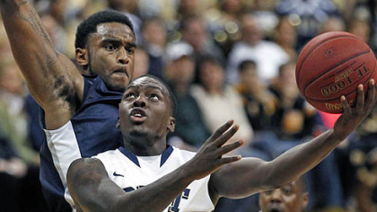 Pittsburgh's Tray Woodall goes up for a shot in front of North Florida's David Jeune in the first half.