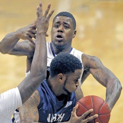 Dante Taylor defends North Florida's Travis Wallace in the second half of Pitt's 89-47 win Saturday night.
