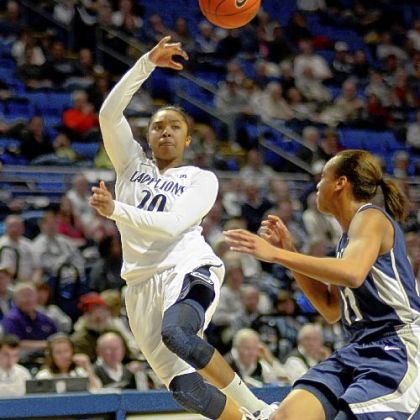 Penn State's Alex Bentley passes across the paint past Georgetown's Andrea White in the Nittany Lions' home victory.