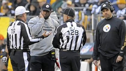 Steelers coach Mike Tomlin and offensive coordinator Todd Haley listen in the third quarter as referee Scott Green and side judge Larry Rose explain that Ben Roethlisberger's lateral pass was ruled a fumble and recovered for a touchdown by the Chargers Sunday at Heinz Field.