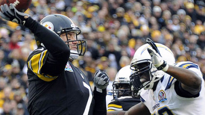 Ben Roethlisberger gets a pass off as he's defended by the Chargers' Demorrio Williams in the second quarter.