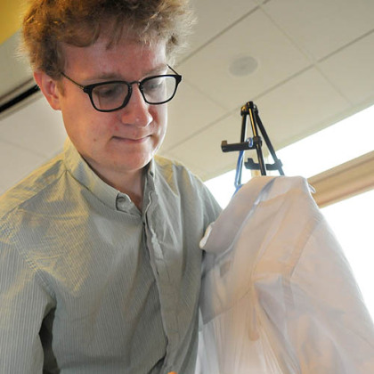 John Howland demonstrates his team's magnetic curved iron that doesn't require an ironing board. Carnegie Mellon University seniors today showed off Senior Capstone Design Projects for their mechanical engineering course.