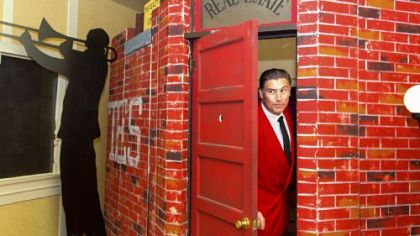 Speakeasy Gangster Howard Mincone asks for the password at the faux door to Speakeasy during its opening on Wednesday.