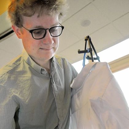 John Howland demonstrates his team's Magnetic Curved Iron, which doesn't require an ironing board.