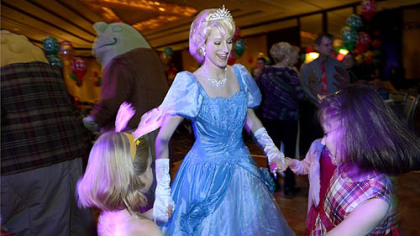 Katherine Bodner, of Jefferson Hills,  Cinderella for the night, dances with children at the Reindeer Ball.