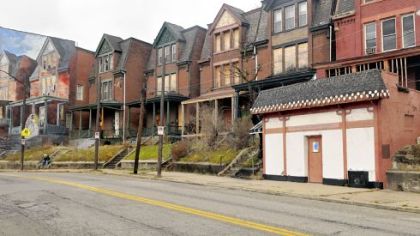 Pittsburgh Glass Center has purchased the former Kim's Coffee Shop, right, not far from the Bride of Penn Avenue mural, left.