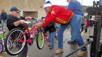 Bill Ringler, left, and Andy Burch, both of Tarentum, load some of the 300 bicycles donated by Al's Bike Drive to the Marine Corps Toys for Tots program on Tuesday. The men are members of the Allegheny Valley Detachment 827 of the Marine Corps League.